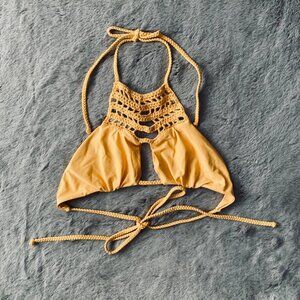 Frankie’s Bikinis goddess golden crochet halter bikini top